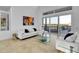 Bright living room with high ceilings, a large window, and modern decor at 6113 Pasadena Point Blvd, Gulfport, FL 33707