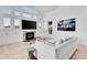 Bright living room boasts large windows, fireplace, and modern decor at 6113 Pasadena Point Blvd, Gulfport, FL 33707