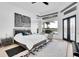 Stylish bedroom with waterfront views, tray ceilings, and modern furnishings at 6113 Pasadena Point Blvd, Gulfport, FL 33707