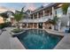 Inviting swimming pool with palm trees and covered patio for outdoor entertaining at 6113 Pasadena Point Blvd, Gulfport, FL 33707
