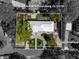A beautiful aerial view shows the entire lot, landscaping, and the home's roofline at 6531 2Nd N Ave, St Petersburg, FL 33710