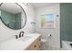 Well-lit bathroom with modern fixtures, colorful tile, and stylish decor elements at 6531 2Nd N Ave, St Petersburg, FL 33710