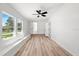 Bright and airy bedroom with multiple windows offering great light and wood flooring at 6531 2Nd N Ave, St Petersburg, FL 33710