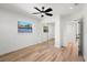 Bedroom featuring hardwood floors, sliding closet doors, and ceiling fan for a modern touch at 6531 2Nd N Ave, St Petersburg, FL 33710
