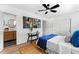 Comfortable bedroom featuring a fan and view into bathroom at 6531 2Nd N Ave, St Petersburg, FL 33710
