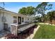Exterior home view features front porch, manicured lawn, and lush plantings at 6531 2Nd N Ave, St Petersburg, FL 33710