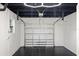Spacious garage features an open garage door, painted floors and walls and updated lighting at 6531 2Nd N Ave, St Petersburg, FL 33710