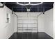 Clean garage with black painted floor, white walls, and newer white garage door at 6531 2Nd N Ave, St Petersburg, FL 33710