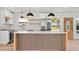 Modern kitchen features stainless appliances, herringbone backsplash, and quartz countertops at 6531 2Nd N Ave, St Petersburg, FL 33710