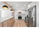 Modern kitchen with stainless steel appliances and pendant lighting above the kitchen island at 6531 2Nd N Ave, St Petersburg, FL 33710