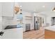 Modern kitchen featuring stainless steel appliances, white cabinets, and a stylish backsplash at 6531 2Nd N Ave, St Petersburg, FL 33710