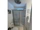 Bright bathroom featuring a glass-enclosed shower with tiled walls and modern fixtures at 665 54Th S St # 133, Gulfport, FL 33707