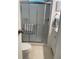 Well-maintained bathroom with a walk-in shower featuring modern fixtures and a tiled interior at 665 54Th S St # 133, Gulfport, FL 33707