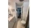 Modern bathroom with marble vanity, built-in shelving, and bright, easy-to-clean surfaces at 665 54Th S St # 133, Gulfport, FL 33707