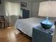 Cozy bedroom featuring wood-look floors, light colored walls, and bright, sun-lit windows at 665 54Th S St # 133, Gulfport, FL 33707