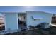 Side exterior of home with covered porch and AC unit outside at 665 54Th S St # 133, Gulfport, FL 33707