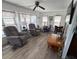 Bright and airy living room with plush seating, wood-look floors, and ample natural light at 665 54Th S St # 133, Gulfport, FL 33707