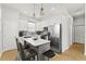 Modern kitchen features stainless steel appliances, an island, and shaker cabinets at 6920 N Hubert Ave, Tampa, FL 33614