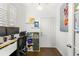 Bright home office featuring a built-in bookshelf and dual monitors at 6920 N Hubert Ave, Tampa, FL 33614