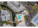 Aerial view of community featuring pool, tennis courts, parking, and waterway at 6923 Stones Throw N Cir # 4205, St Petersburg, FL 33710