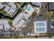 Aerial view of community featuring condos, parking, waterway, and tennis courts at 6923 Stones Throw N Cir # 4205, St Petersburg, FL 33710
