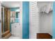 Bathroom featuring tiled shower, toilet, vanity, and closet at 6923 Stones Throw N Cir # 4205, St Petersburg, FL 33710