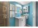 Updated bathroom vanity with storage, mirror, and modern lighting at 6923 Stones Throw N Cir # 4205, St Petersburg, FL 33710