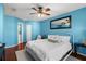 Bright bedroom featuring a ceiling fan, modern decor, and wood floors at 6923 Stones Throw N Cir # 4205, St Petersburg, FL 33710