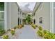 Exterior view of the condo building with landscaping at 6923 Stones Throw N Cir # 4205, St Petersburg, FL 33710