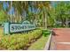 Entrance to Stone's Throw Condominiums, showcasing lush landscaping at 6923 Stones Throw N Cir # 4205, St Petersburg, FL 33710