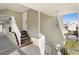 Condo entrance with stairs leading to the front door, covered entry, and railing at 6923 Stones Throw N Cir # 4205, St Petersburg, FL 33710