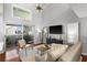 Bright living room with vaulted ceilings, balcony access, and modern furnishings at 6923 Stones Throw N Cir # 4205, St Petersburg, FL 33710