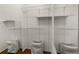 Spacious walk-in closet featuring wood floors, wire shelving, and full-length mirror for optimal storage and organization at 6923 Stones Throw N Cir # 4205, St Petersburg, FL 33710