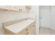 Convenient laundry room featuring cabinets, countertop space, and a utility sink at 6968 De Brita Rd, North Port, FL 34291