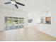 Bright, open living space overlooking the pool area, featuring sliding glass doors and tile flooring at 6968 De Brita Rd, North Port, FL 34291