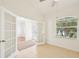 Bright home office features neutral walls, tiled flooring, and natural light from the large window at 6968 De Brita Rd, North Port, FL 34291