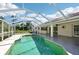 View of the covered outdoor patio and refreshing screened-in pool for outdoor enjoyment at 6968 De Brita Rd, North Port, FL 34291