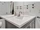 This bathroom features a sleek modern vanity with glass shelving, contemporary fixtures and a large mirror at 7300 Sun Island S Dr # 903, South Pasadena, FL 33707