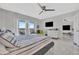 Bright bedroom featuring a ceiling fan, view from the balcony, and white modern drawers at 7300 Sun Island S Dr # 903, South Pasadena, FL 33707