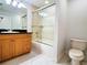 Bathroom with light-wood vanity, shower/tub combination, and tile floors at 750 4Th S Ave # 603C, St Petersburg, FL 33701