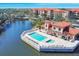Aerial view showcasing the pool and clubhouse and lakefront residences at 7710 Lake Vista Ct # 205, Lakewood Ranch, FL 34202