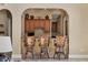 Cozy bar area with stylish bar stools and warm lighting, ideal for entertaining guests at 7710 Lake Vista Ct # 205, Lakewood Ranch, FL 34202
