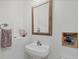 Half bathroom featuring a modern sink and fixtures with fun, quirky decor and artwork at 7710 Lake Vista Ct # 205, Lakewood Ranch, FL 34202