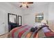 Bedroom featuring neutral colors, plush bed, and wood-look floors for comfort and style at 7710 Lake Vista Ct # 205, Lakewood Ranch, FL 34202
