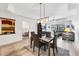 Open layout of dining and living area, with view of bedroom and outdoor scenery at 7710 Lake Vista Ct # 205, Lakewood Ranch, FL 34202