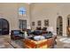 Elegant lounge area with plush leather seating, arched doorways, and tasteful decor accents at 7710 Lake Vista Ct # 205, Lakewood Ranch, FL 34202