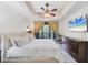 Bedroom with bed, dresser, and curtains with access to balcony and outdoor view at 7710 Lake Vista Ct # 205, Lakewood Ranch, FL 34202