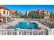 Inviting community pool area with comfortable lounge chairs, providing a perfect spot for relaxation at 7710 Lake Vista Ct # 205, Lakewood Ranch, FL 34202