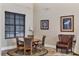 Comfortable sitting area with leather chairs, a table, and large window for relaxing and reading at 7710 Lake Vista Ct # 205, Lakewood Ranch, FL 34202