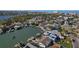 Wide aerial showing a waterfront property and private dock within a canal community near the ocean at 1101 Bay Pine Blvd, Indian Rocks Beach, FL 33785